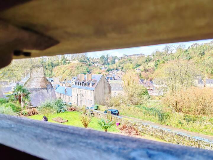 a view of a town from a window of a house at Le relai de la tannerie in Lanvallay