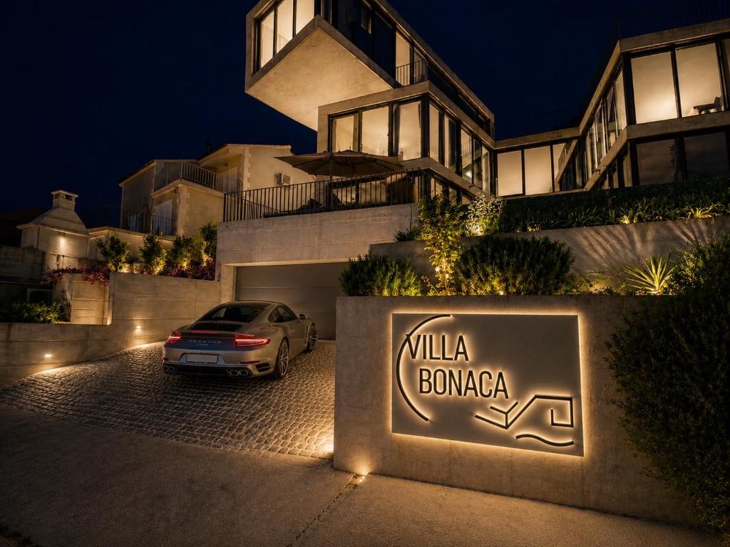 a car parked in front of a house at night at Villa Bonaca in Korčula