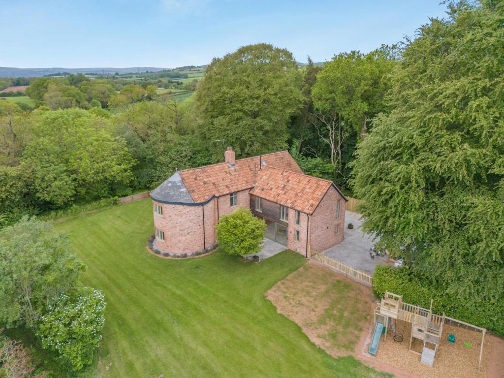 an aerial view of a brick house in a field at 4 Bed in Taunton oc-w35167 in West Monkton