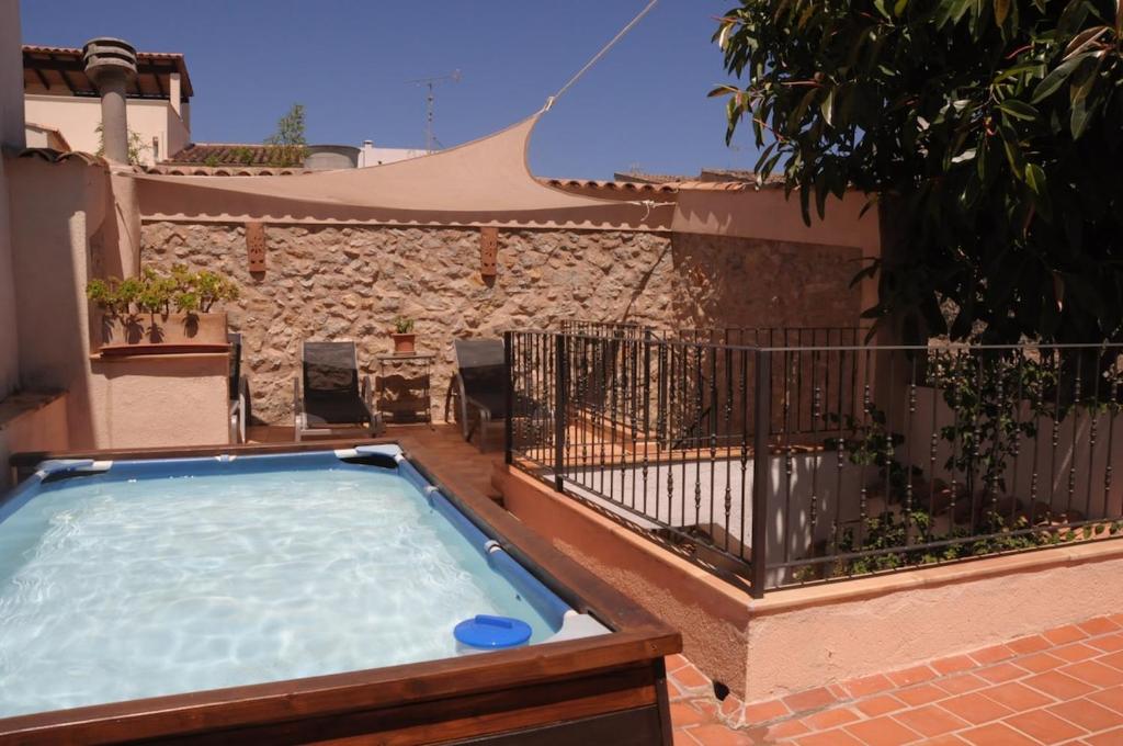 a hot tub on a balcony of a house at Ca nostra in Artá