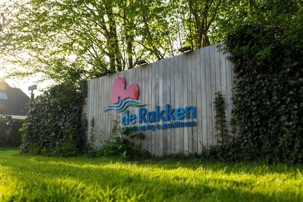 a fence with a sign that says be rockenstein at De Rakken in Woudsend