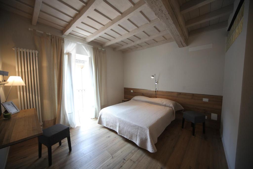 Posteľ alebo postele v izbe v ubytovaní 32 BnB Camerecaffè