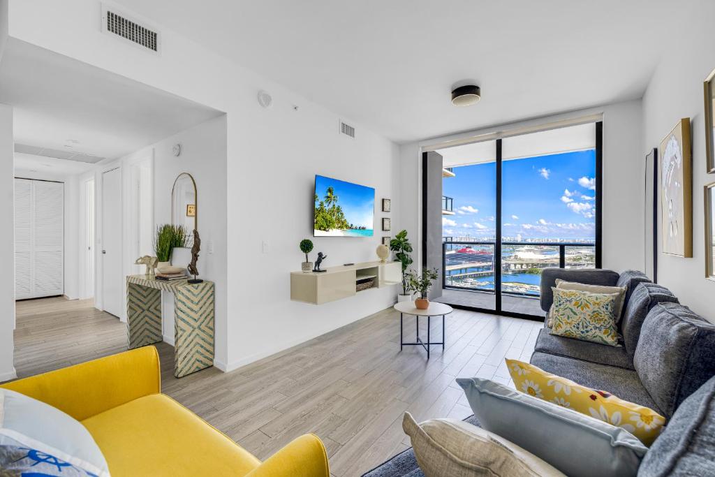 a living room with a couch and a table at Miami Skyline Escape in Miami