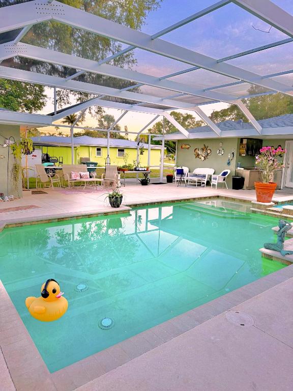 a swimming pool with a rubber duck in the water at Manatee River Bungalow in Bradenton