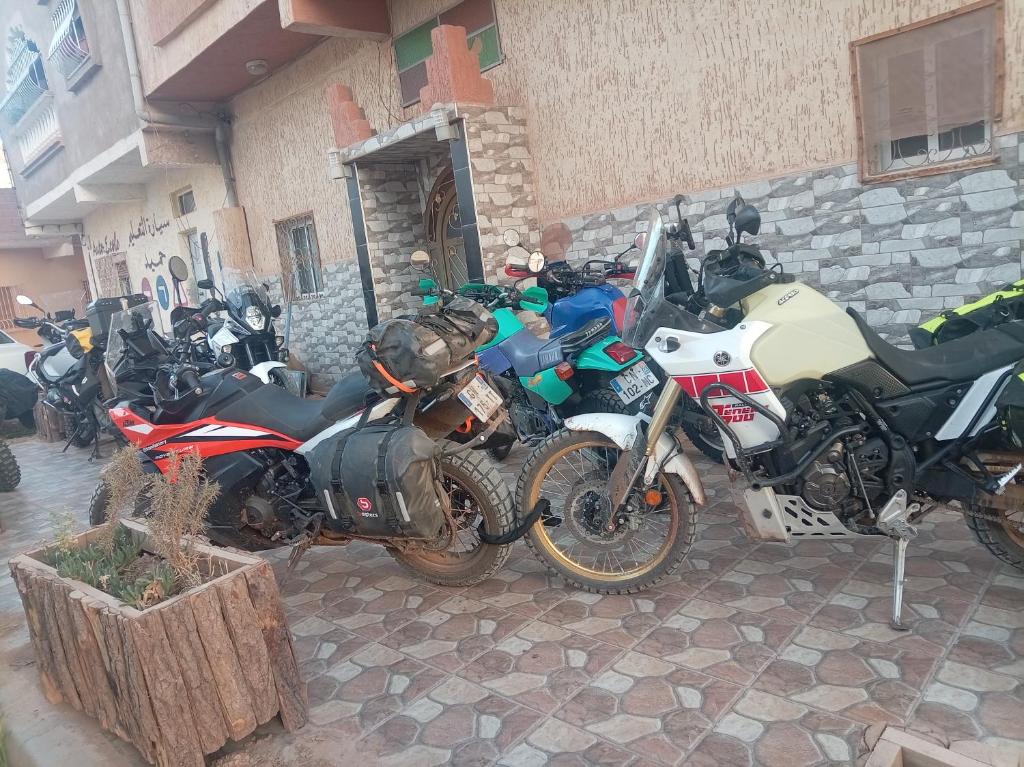 a group of motorcycles parked in front of a building at Maison d'hôtes de Zaida in Zeïda