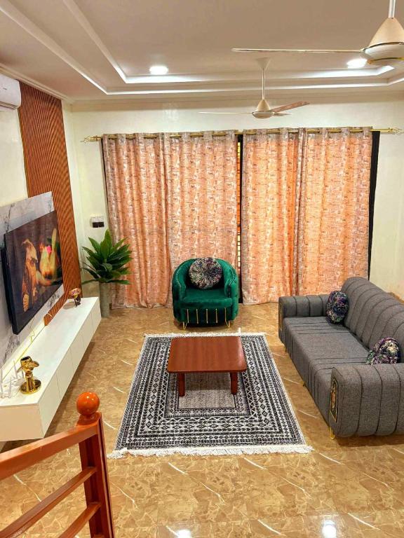 a living room with a couch and a table at Prestige A4 in Ouagadougou