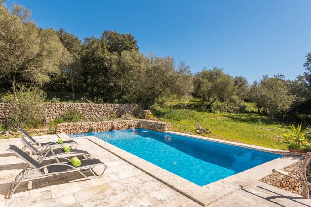 an image of a swimming pool in a villa at Finca Ses Curtanetas by 3VILLAS in Alaior