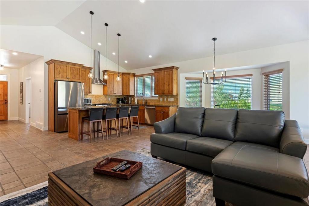 a living room with a couch and a kitchen at Piney Ridge TR6 Hot Tub Pool in Eden