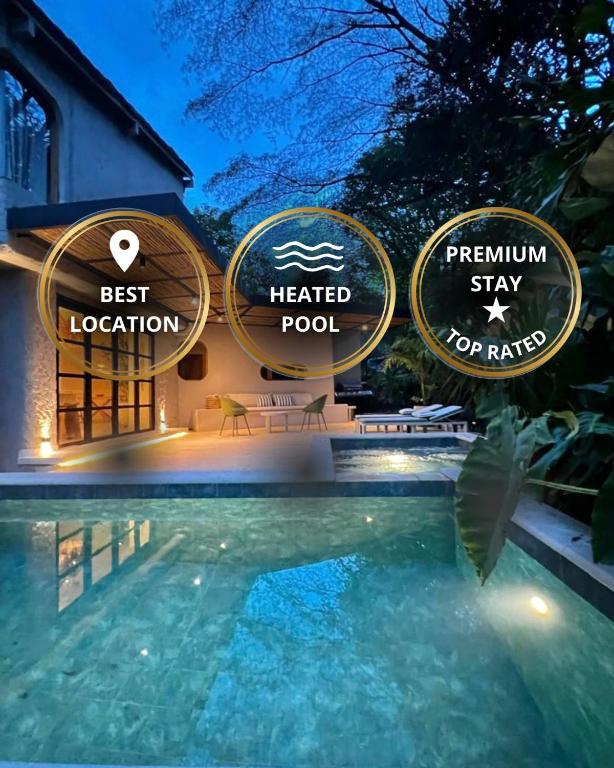 a resort with a swimming pool at night at Macondo House Private Heated Pool in Medellín
