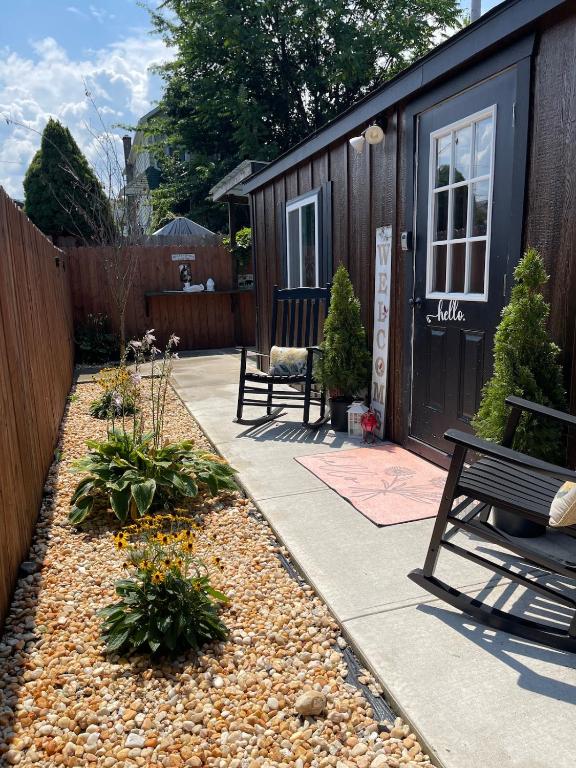 a backyard with a bench and a fence at Cabin Experience near all in Wilkes-Barre