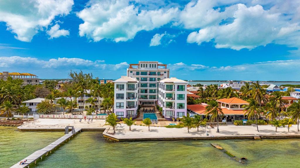 an aerial view of a resort with a body of water at Diamante Beachfront Suites in San Pedro