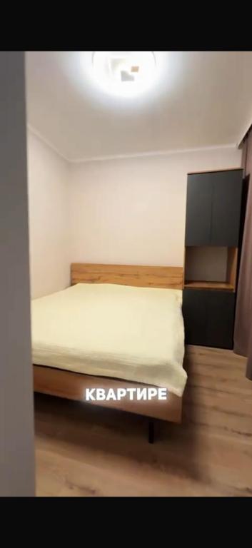 a bedroom with a bed in a room at BonHome квартиры in Bulan Sogottuu