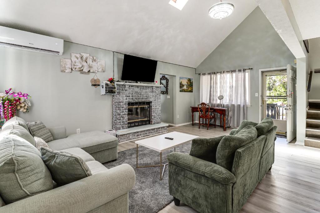 a living room with two couches and a fireplace at Lake Access & Game Room! Poconos Resort Getaway in Tobyhanna