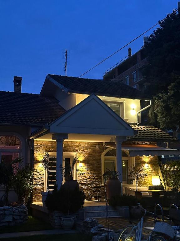 a house with a porch with lights on it at La dolce vita in Novi Banovci