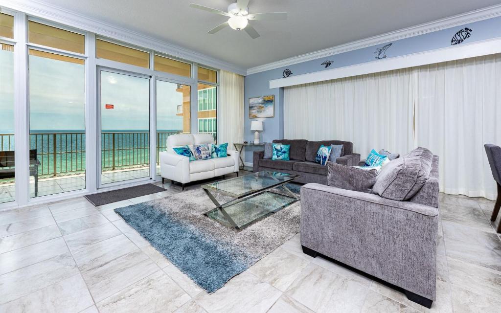 a living room with a view of the ocean at Phoenix Gulf Towers 805 condo in Gulf Shores