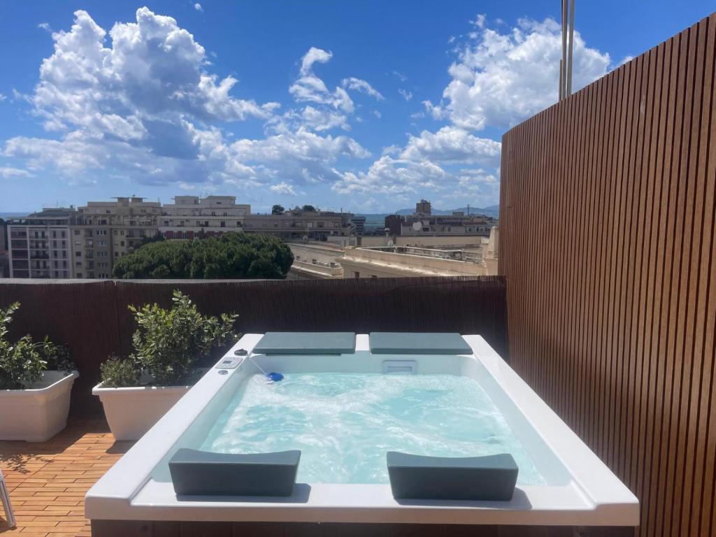 a hot tub on the balcony of a building at Bluemoon Sardinia Roof Garden Jacuzzi in Cagliari