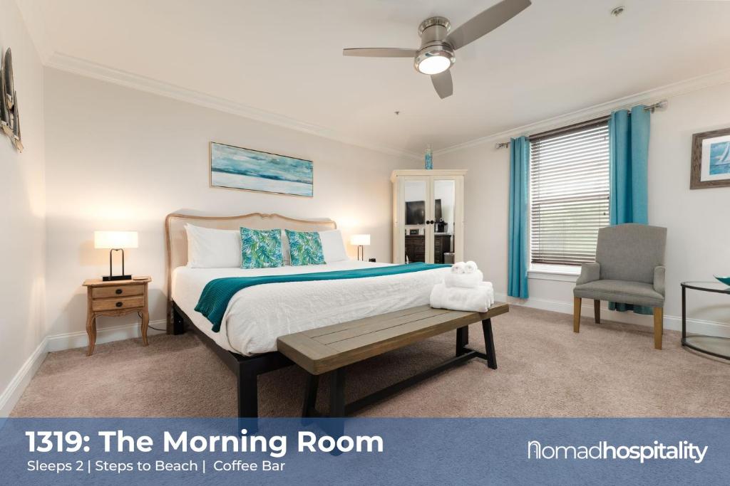 a bedroom with a bed and a table and a chair at Be A Nomad - 1 blk to beach - Stylish studio in Jacksonville Beach