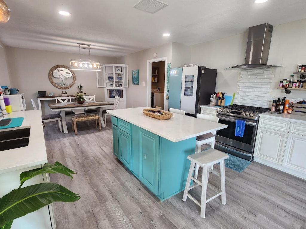 a kitchen with a blue island in the middle of it at H20 paradise in Texas City