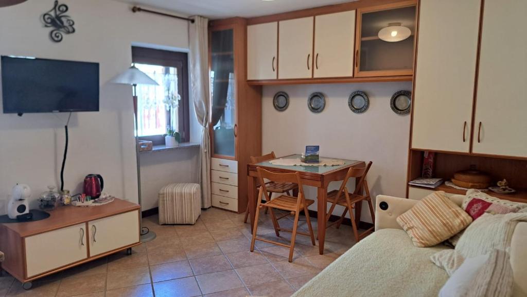 a living room with a couch and a table at Chez Néné in Châtillon