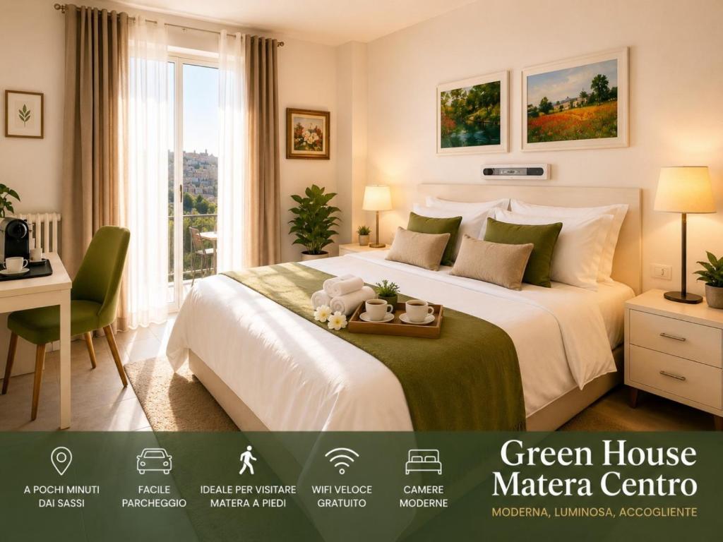 a bedroom with a white bed and a desk and a window at Green House Matera Centro in Matera