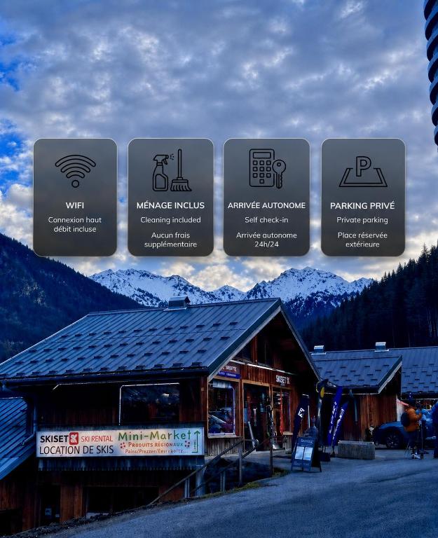 a group of signs in front of a building at Studio au pied des pistes - Vue montagne in Saint-Jean-d'Aulps