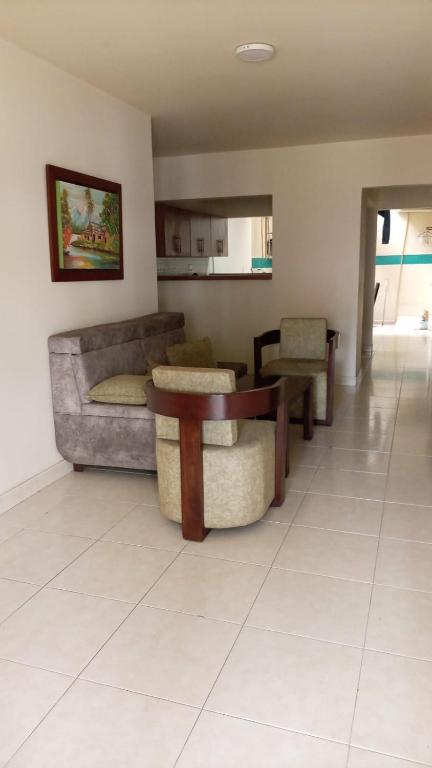 a living room with a couch and a table at Ginebramagico in Ginebra