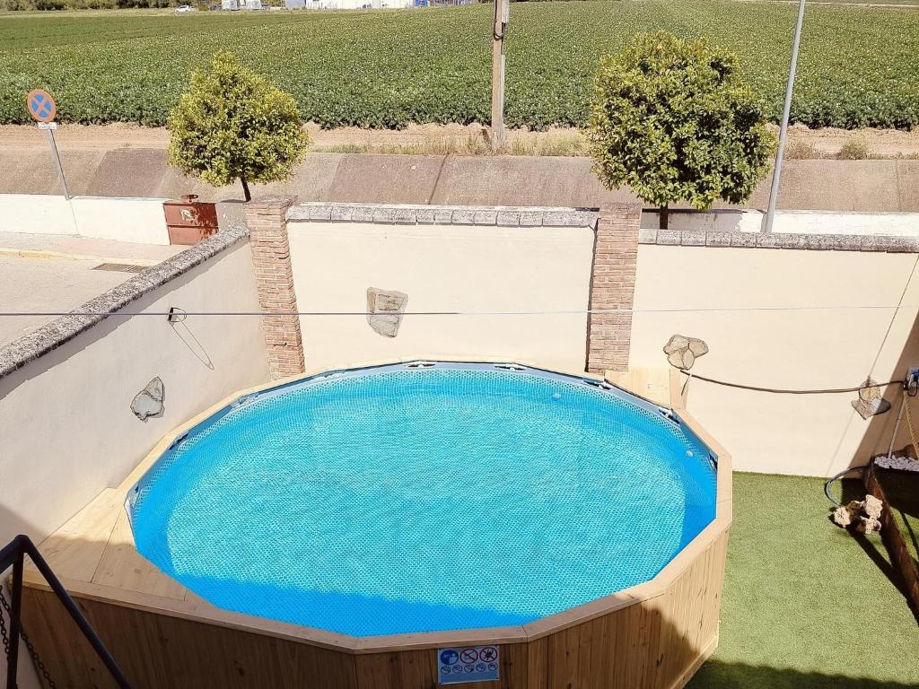 an overhead view of a large swimming pool at Chalet in Rivero de Posadas with Pool in Rivero de Posadas