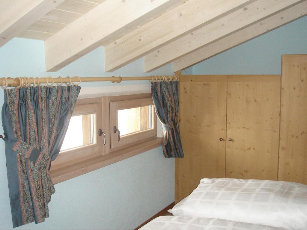 Postel nebo postele na pokoji v ubytování Armonia Livigno Appartamenti