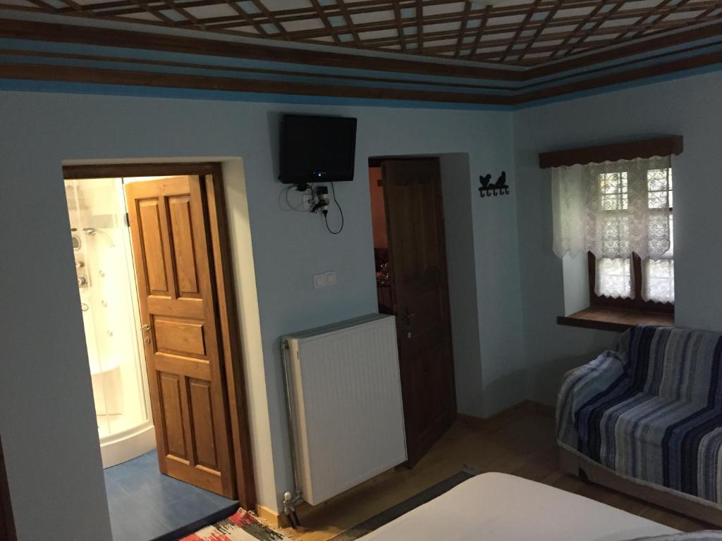 Postel nebo postele na pokoji v ubytování Elafotopos Hotel