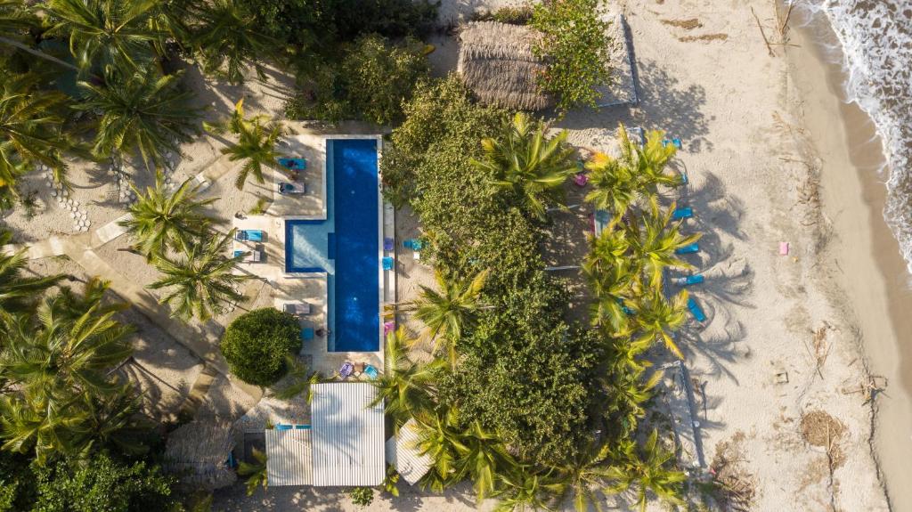 an overhead view of a swimming pool on a beach at Blue Mango Beach Hotel in Guachaca