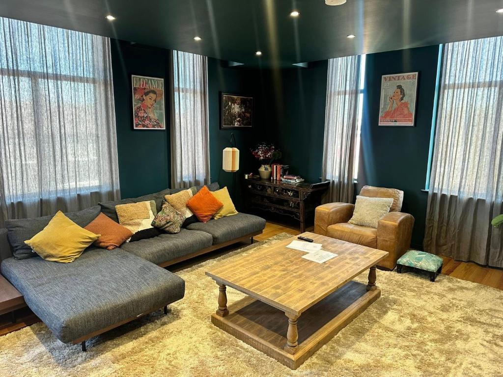 a living room with a couch and a coffee table at STUNNING Apartments in Jarrow, next to A19 & Tyne Tunnel in East Howdon