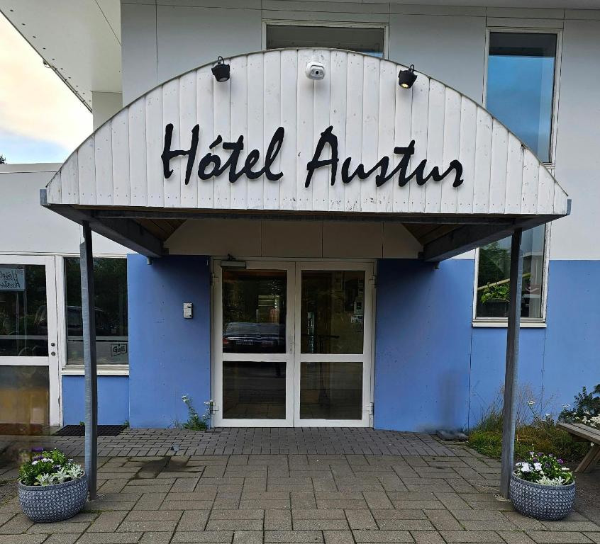 a hotel authority sign on the front of a building at Hótel Austur in Reyðarfjörður