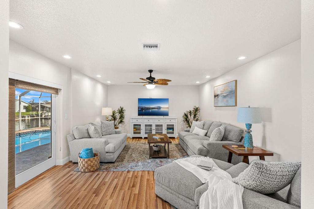 a living room with a couch and a tv at 1480 W Riviera Dr in Merritt Island