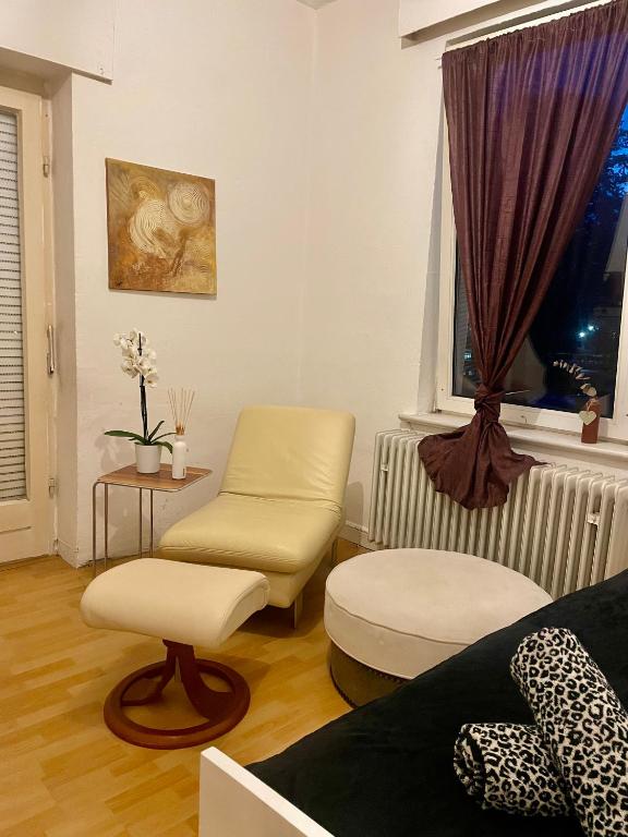a living room with two chairs and a couch at Smart in Bad Pyrmont
