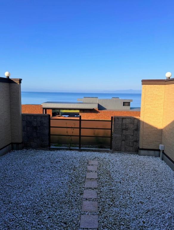 a view of the beach from the roof of a building at バリアンリゾート山口BarianResort Yamaguchi in Sanyoonoda