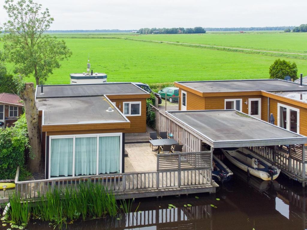 an aerial view of a house on the water at Sluisje 55 in Kuinre