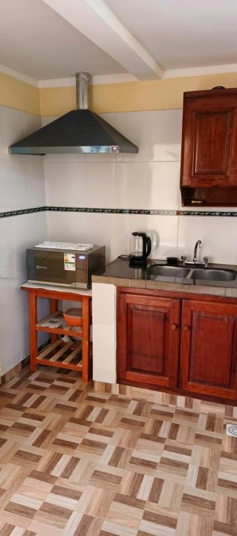 a kitchen with a sink and a counter top at Luz de la puna in La Quiaca