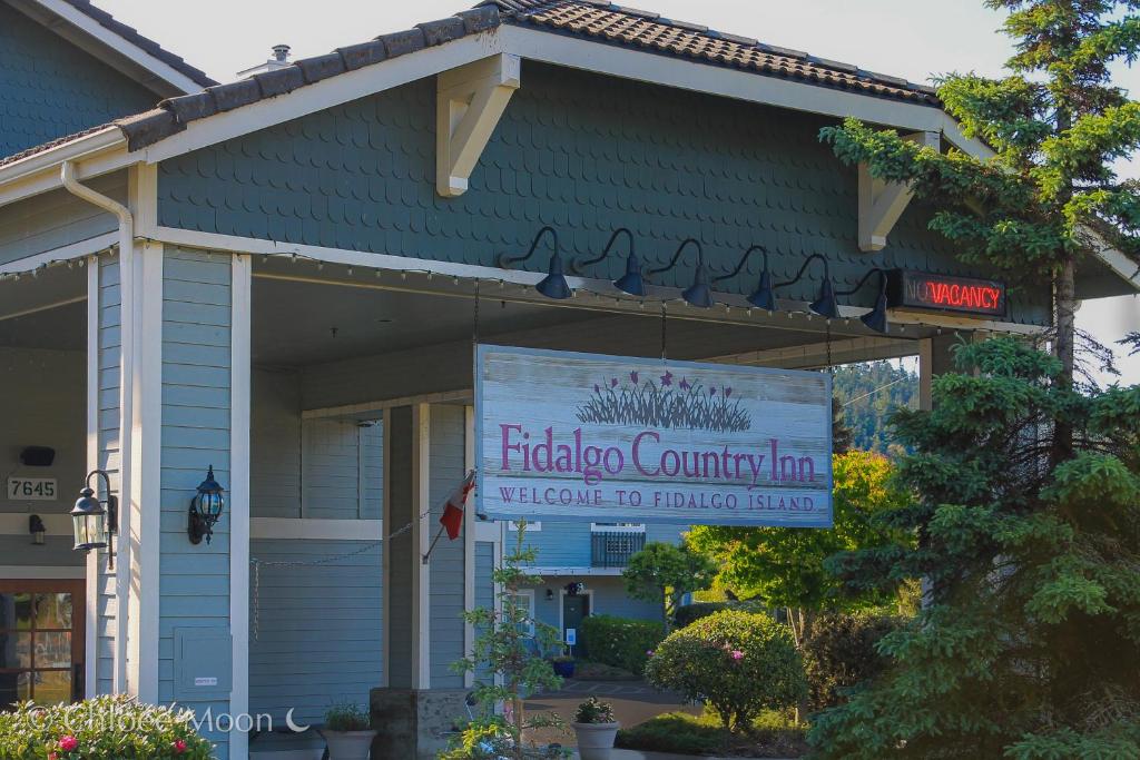 a building with a sign in front of it at Fidalgo Country Inn in Anacortes