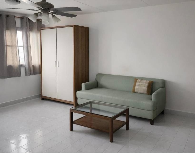 a living room with a couch and a coffee table at Ally home 14 08 in Ban Bang Phang