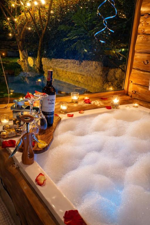 a bath tub filled with snow in front of a window at Chalet el Pinar in La Calera