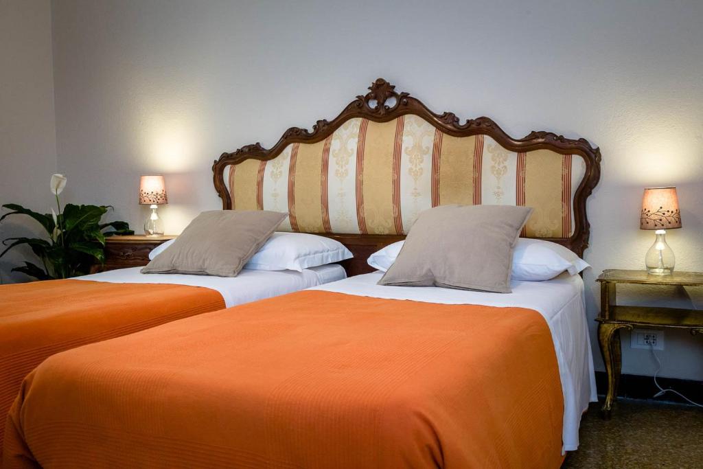 Postel nebo postele na pokoji v ubytování B&B I Portici Di Sottoripa