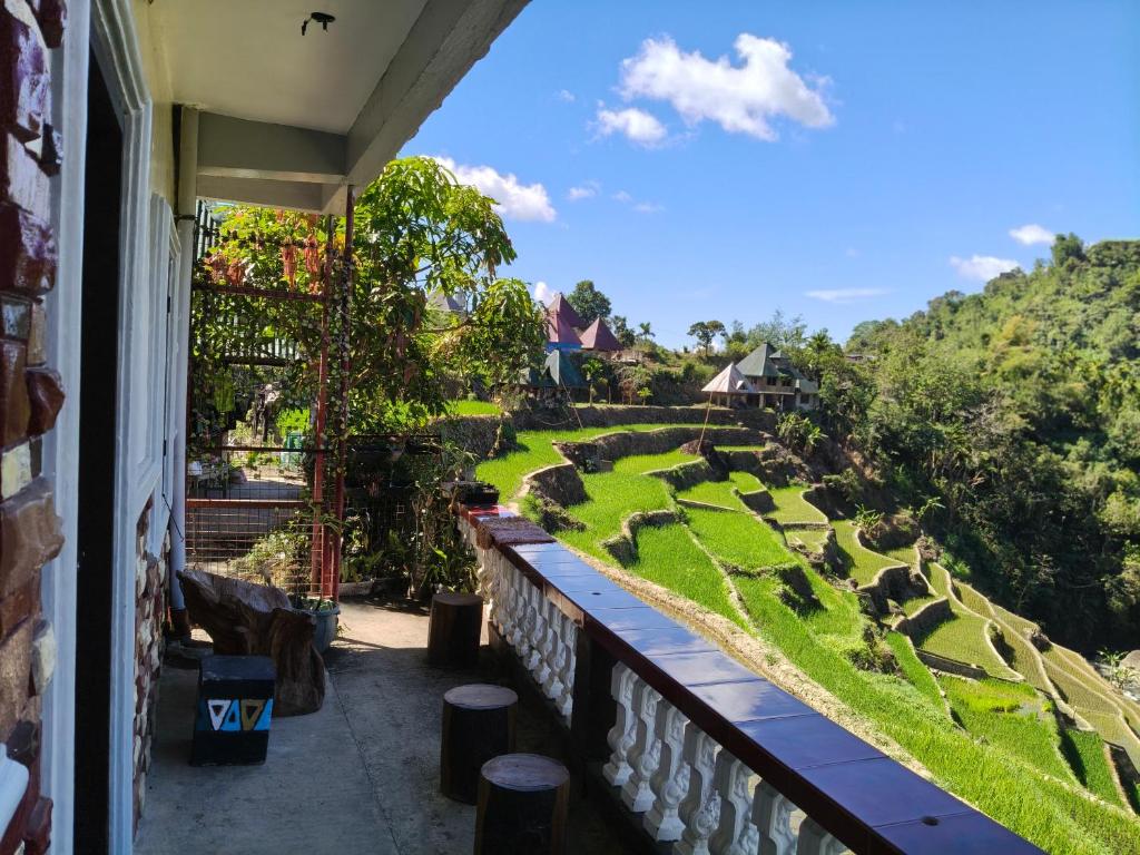 a view of a garden from a balcony at Bogah Lodge in Banaue