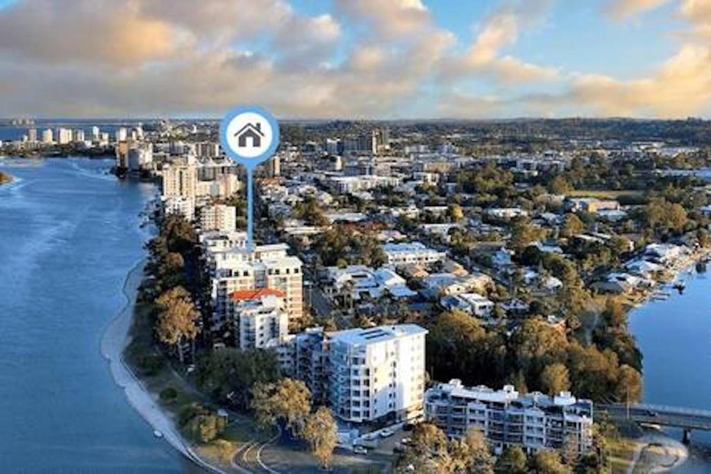 an aerial view of a city with a road sign at Picnic Point Panoramic Views in Maroochydore