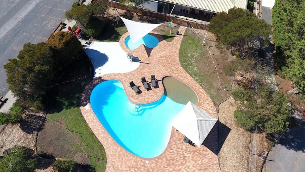 an overhead view of a park with a swimming pool at Sundown Villas in Canberra