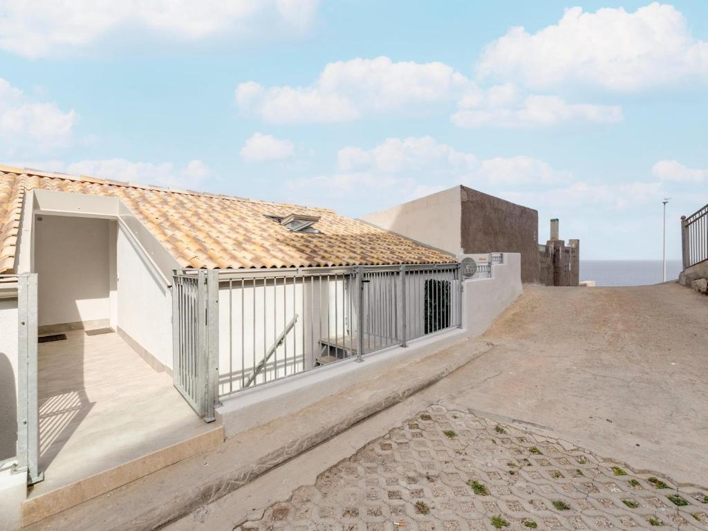 a view of the balcony of a house at Brand new attic studio apartment, air conditioned in Castelsardo