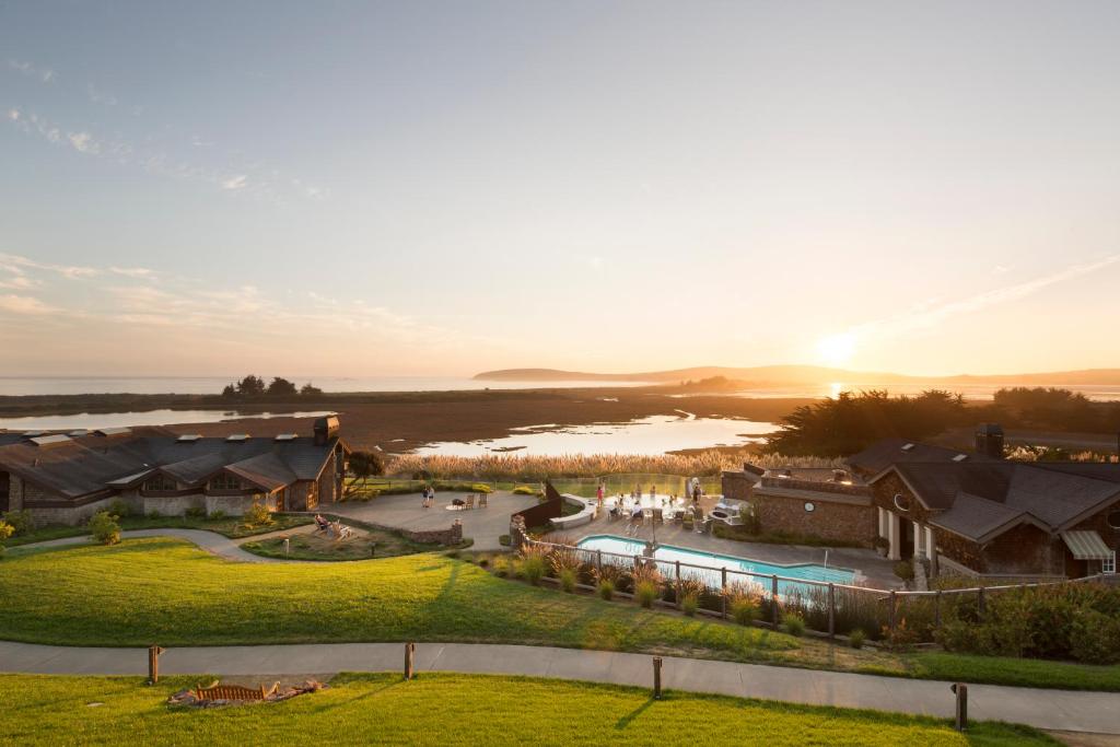 an aerial view of a resort with a body of water at The Lodge at Bodega Bay in Bodega Bay