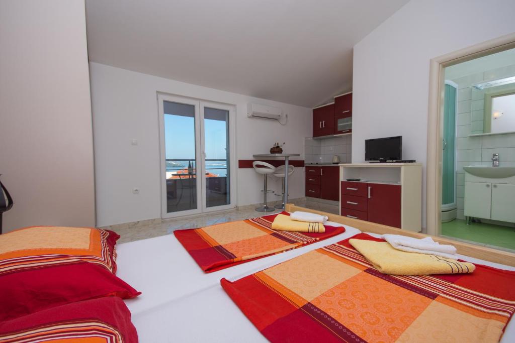 Posteľ alebo postele v izbe v ubytovaní Apartments Jaman Ivan