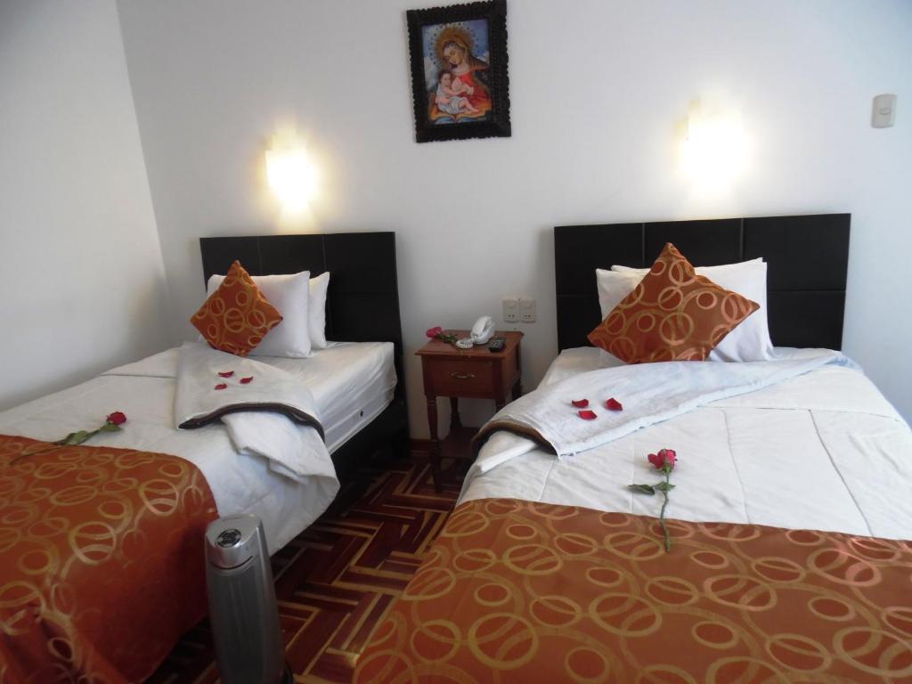 Postel nebo postele na pokoji v ubytování Hotel Puno Terra