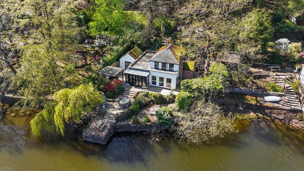 an aerial view of a house on the water at The Sheiling in Leek