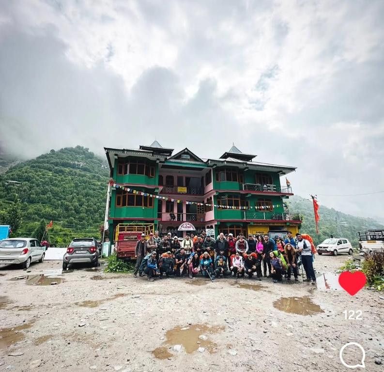 a group of people standing in front of a building at lake view resort kafnoo in Yangpa